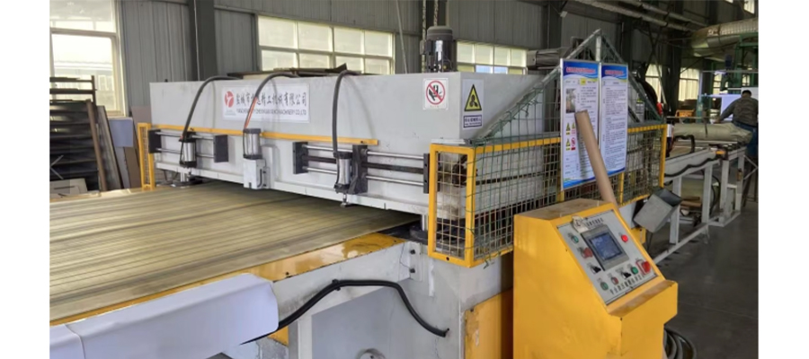 Yoga mat cutting and sizing machine